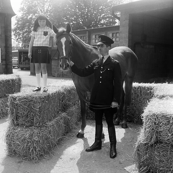 Sally Jones (9) from Bucks, pictured with the horse she named Warrior and PC Tom TucKer