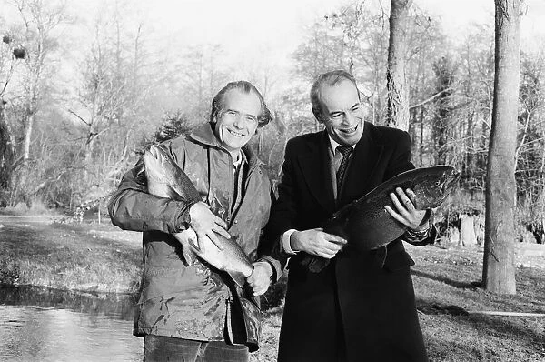 Sam Holland (left), trout farmer with James Pettigrew, hold some of the outsize trout at
