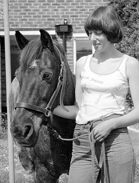 Sam the pet pony with his owner in the garden at his home in Woodingdean