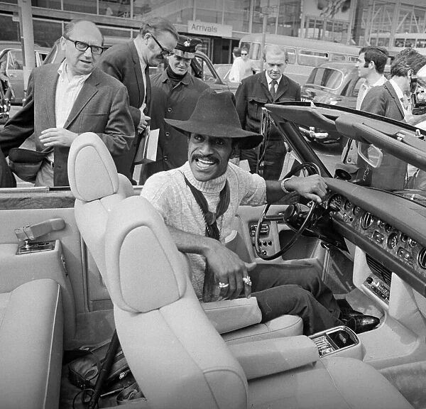 Sammy Davis Jnr in his new Rolls-Royce convertible at Heathrow