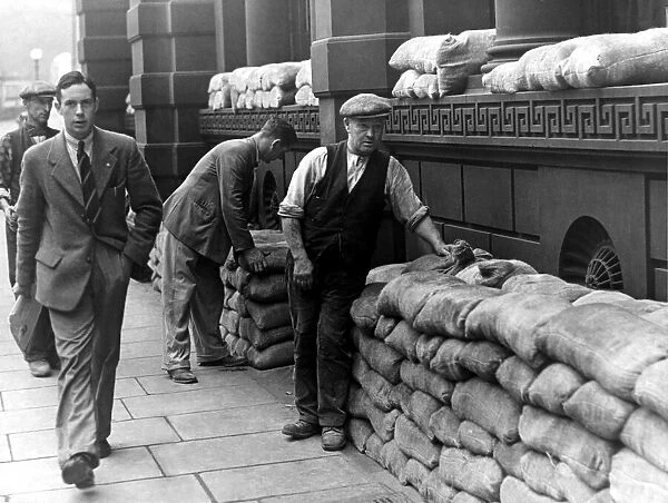 Sandbags are placed for the protection of buildings in Newcastle in prepartion for air