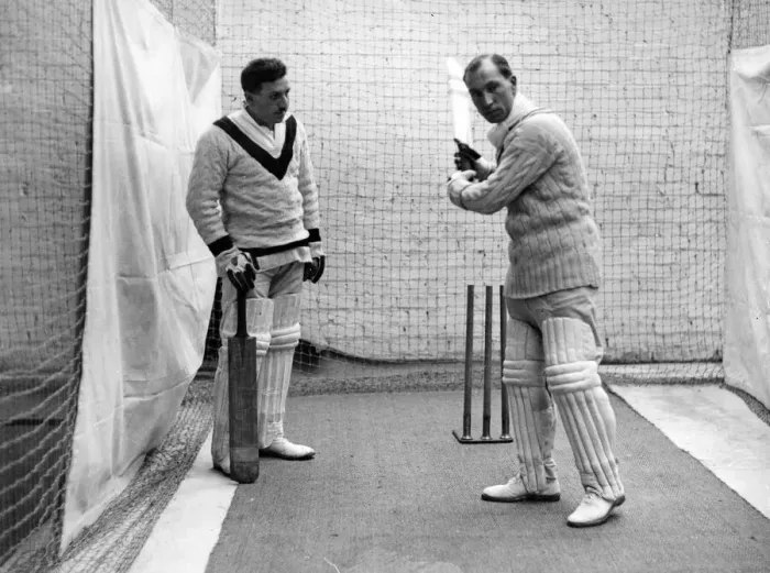 Framed Print : Sandham demonstrating a batting stroke to a pupil at the indoor cricket school opened Framed Print : Sandham demonstrating a batting stroke to a pupil at the indoor cricket school opened