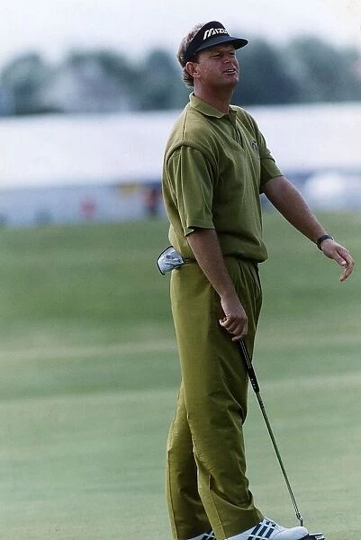 Sandy Lyle golfer holding putter golf club