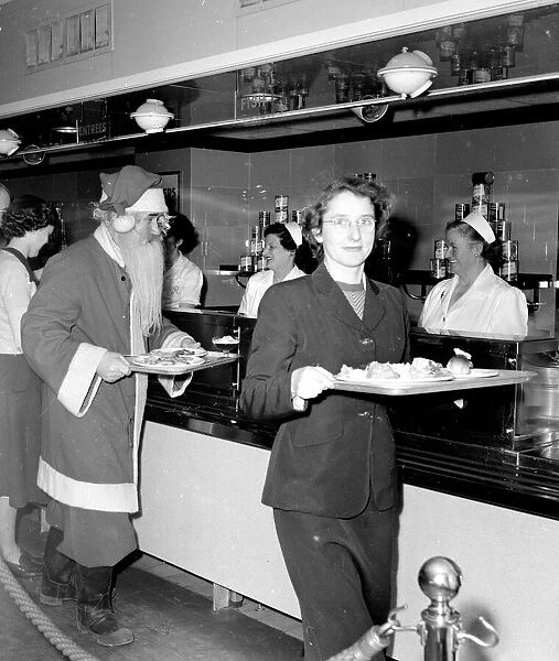 Santa Claus collects his lunch at the staff canteen at Kingston Store after a hard
