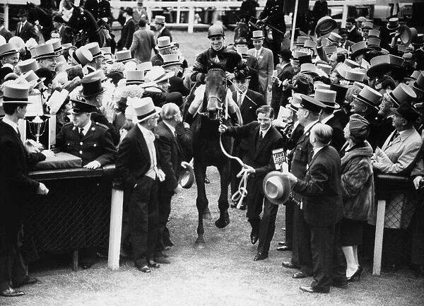 Santa Claus and jockey Scobie Breasley are led into the winners enclosure after winning