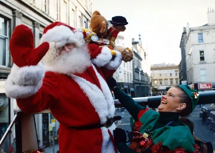 Framed Print : Santa Claus with one of his little elf helpers pictured in Glasgow December 1991 Framed Print : Santa Claus with one of his little elf helpers pictured in Glasgow December 1991