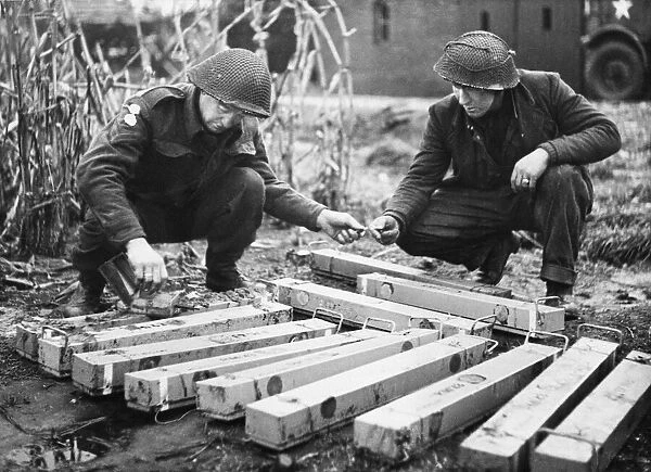Sappers of the 51st Highland Division make safe these anti-personnel mines removed