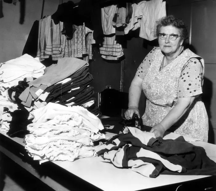 Framed Print : Sara Bratt who does the laundry for Burnley Football Club seen here ironing the teams Framed Print : Sara Bratt who does the laundry for Burnley Football Club seen here ironing the teams