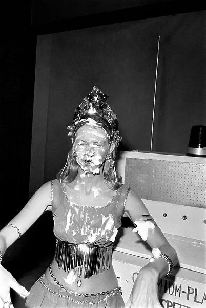 Sara Wade covered in cream after custard pies had been thrown at her
