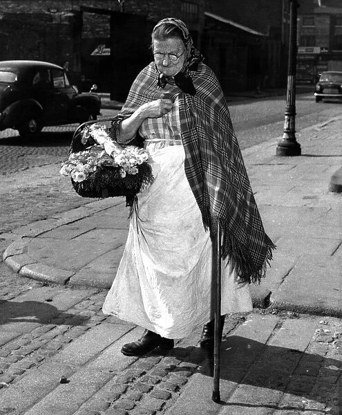 Sarah Burke 78 from Baker Street Liverpool, heads home after a day spend selling flowers