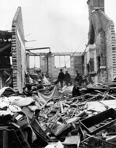 Scene at Chingford, London, where ARP men are clearing damage. Circa 1941