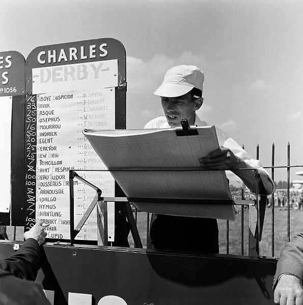 A scene at Derby Day at Epsom. A bookies clerk complete with white hat busily