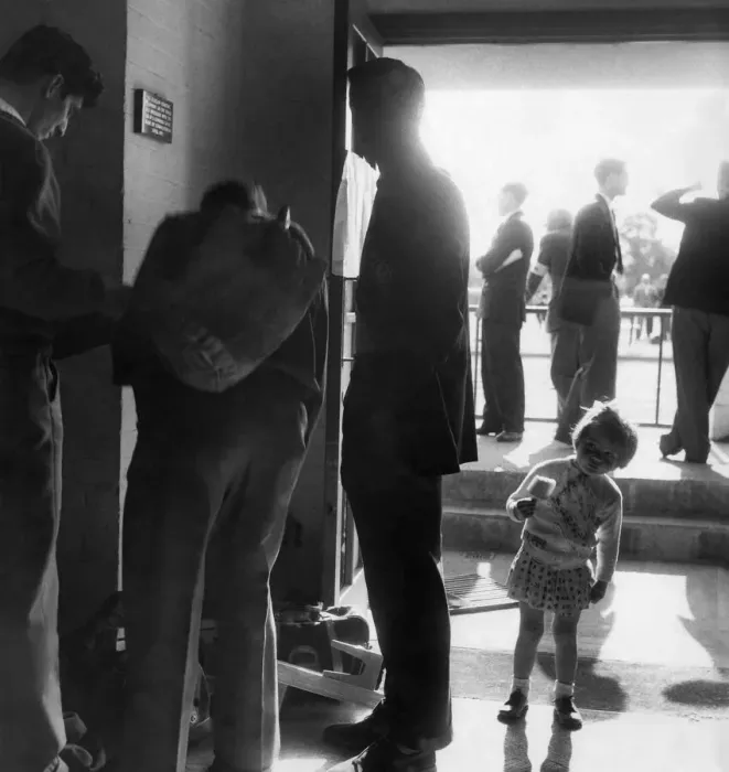 Framed Print : Scene at the mens dressing rooms when athletes dressed have a chat at the entrance