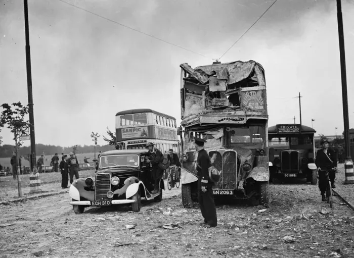Framed Print : Scene showing considerable damage to the front of a bus following an air raid by Framed Print : Scene showing considerable damage to the front of a bus following an air raid by