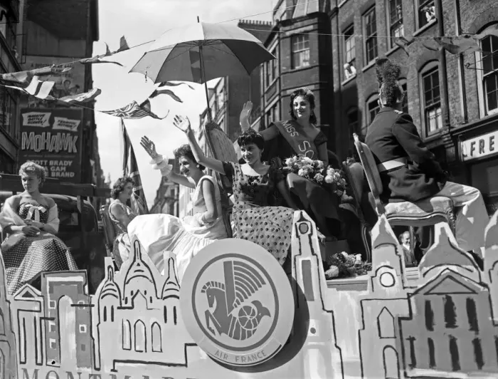 Framed Print : Scenes during the annual Soho Fair in Central London. Miss Soho waving to Framed Print : Scenes during the annual Soho Fair in Central London. Miss Soho waving to