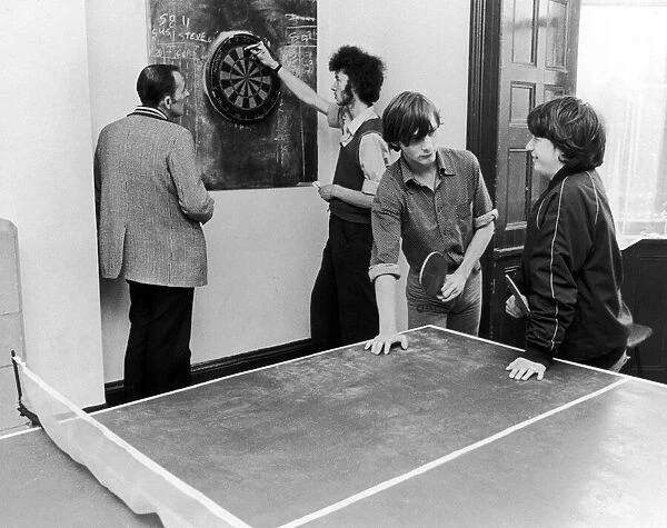 Scenes inside Norton house showing people playing table tennis