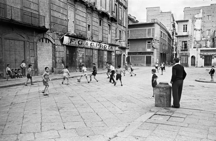 Framed Print : Scenes in Naples, southern Italy showing young boys enjoying a game of football in Framed Print : Scenes in Naples, southern Italy showing young boys enjoying a game of football in
