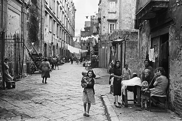 Scenes showing life for residents in a back street of Naples, southern Italy