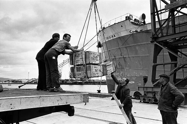 Scenes at Swansea Docks, Wales. Loading steel for Poona, via Bombay, are Gwilym Williams