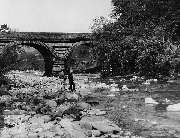 A scenic view near the bridge across the River Tyne at Alston, Cumbria. June 1934