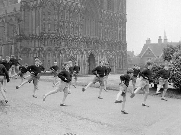 School boys do their daily PT in the grounds of Lichfield Cathedral. September 1959