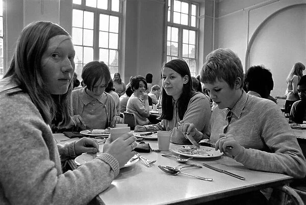 School Dinners. General scenes of school dinner. Ladies serving meal to pupils in