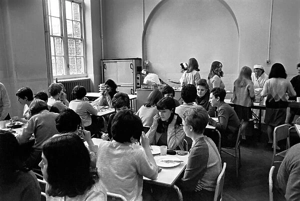 School Dinners. General scenes of school dinner. Ladies serving meal to pupils in