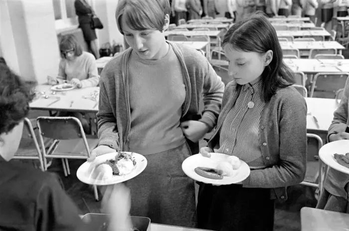 Framed Print : School Dinners. General scenes of school dinner. Ladies serving meal to pupils in Framed Print : School Dinners. General scenes of school dinner. Ladies serving meal to pupils in