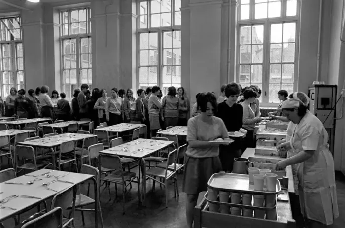 Framed Print : School Dinners. General scenes of school dinner. Ladies serving meal to pupils in