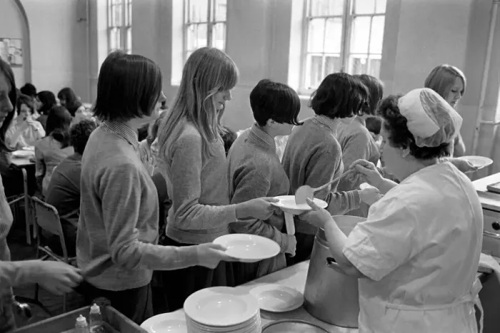 Framed Print : School Dinners. General scenes of school dinner. Ladies serving meal to pupils in Framed Print : School Dinners. General scenes of school dinner. Ladies serving meal to pupils in