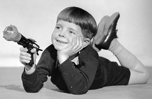 Schoolboy seen here playing with a Dan Dare ray gun 2nd December 1957