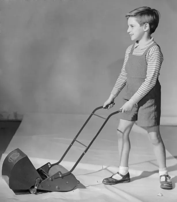 Framed Print : Schoolboy seen here playing with a toy lawn mower 2nd December 1957 Framed Print : Schoolboy seen here playing with a toy lawn mower 2nd December 1957