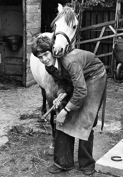 Schoolboy Trevor Escott is spending part of his school holidays helping to shoe horses