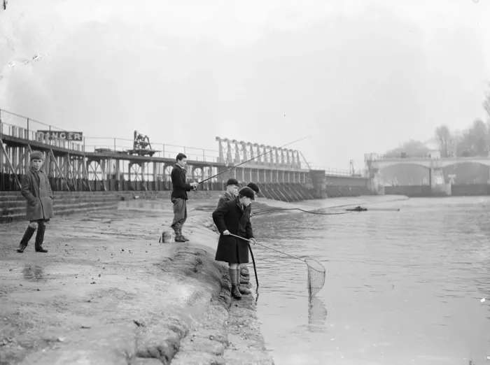 Framed Print : Schoolboys fishing at Teddington Weir during the winter drought of 1933 Framed Print : Schoolboys fishing at Teddington Weir during the winter drought of 1933