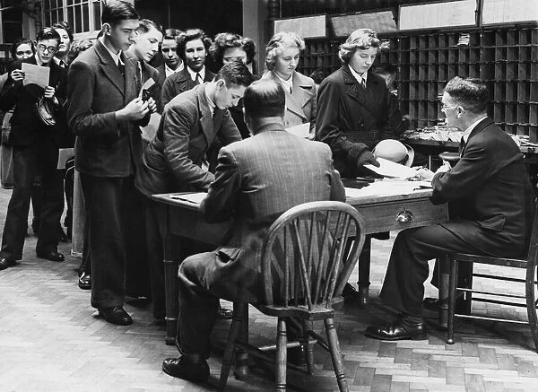 Schoolboys and girls enrolling for Post Office work in Reading. 15th December 1942