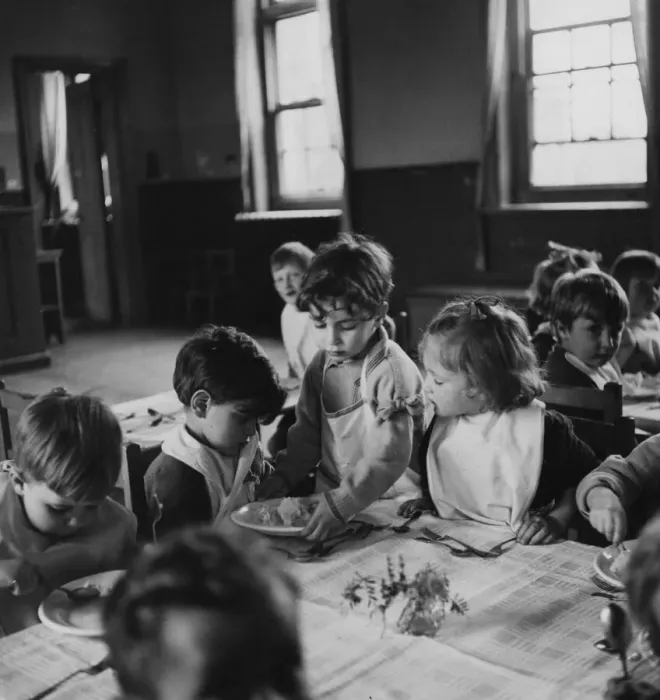 Framed Print : One of the schoolchildren helping to serve school dinners at the London County Framed Print : One of the schoolchildren helping to serve school dinners at the London County