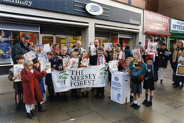 Schoolchildren using old Christmas cards to spread the message about recycling