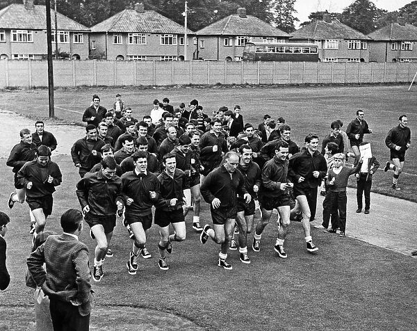 Schoolchildren watch Liverpool team training session at Melwood February 1965