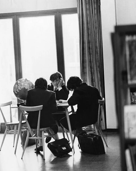 Schoolgirls studying in the school library circa 1965