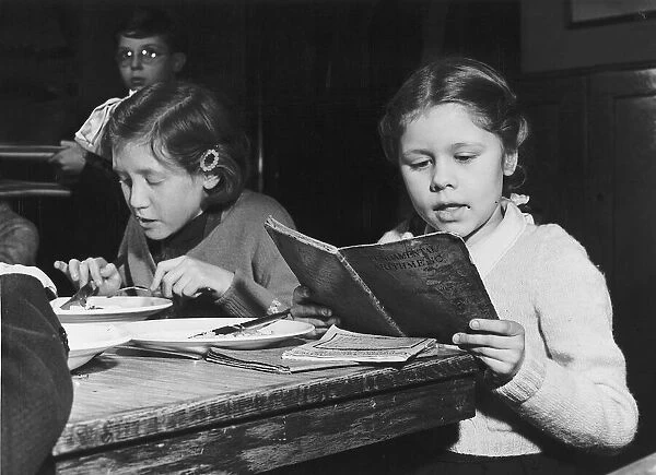 Schools Jose Wettner a pupil at the John Rennie School London revising for an exam. 1954