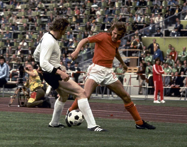 Schwarzenbeck West Germany tackles Hollands Willy Van De Kerkhof in the 1974 World Cup
