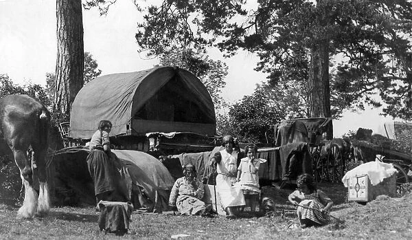 One of the scores of gypsy families who are encamped by the road side in June 1934