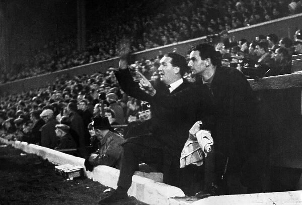 Scotland football manager Jock Stein and Walter McCrae cheer on their team after Scotland