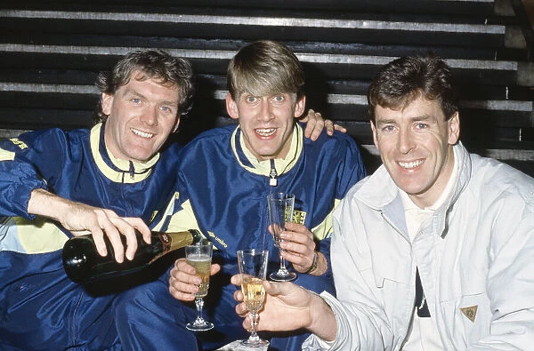 Scotland footballer Gary Mackay (centre) is toasted by Roy Aitken
