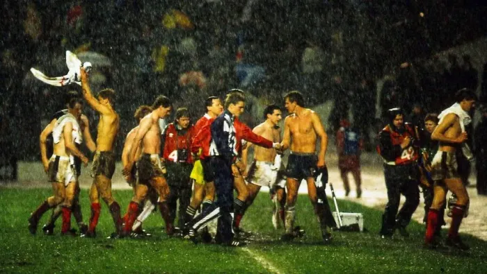 Framed Print : Scotland players leave pitch in heavy rain following their World Cup qualifier against Framed Print : Scotland players leave pitch in heavy rain following their World Cup qualifier against
