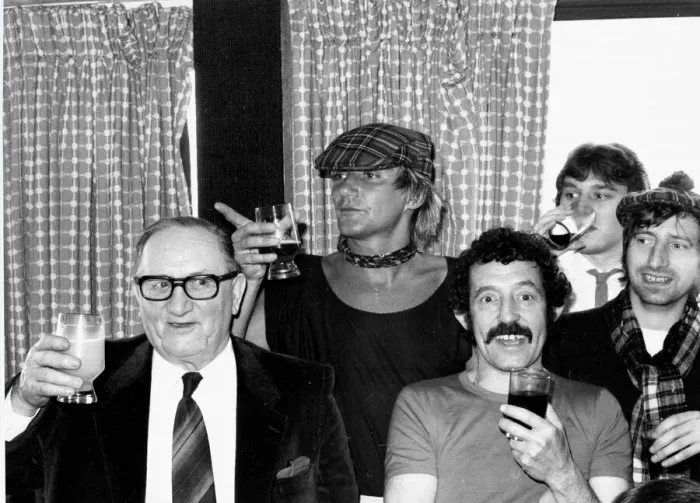 Framed Print : Scotlands Rock superstar Rod Stewart celebrates with a drink after the England v