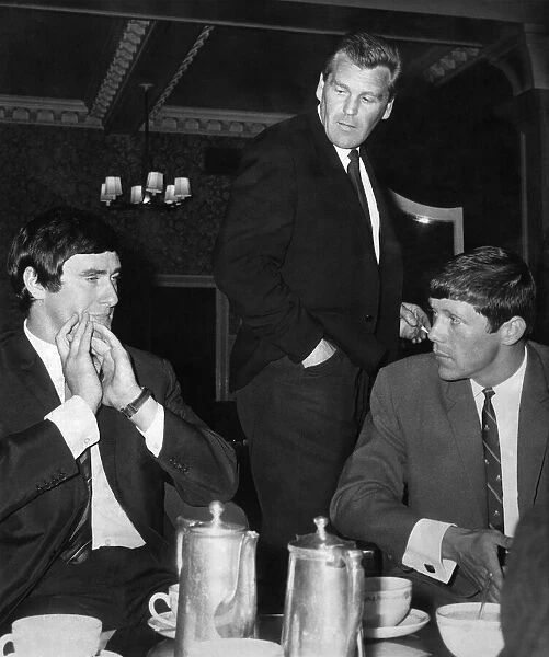 Scottish them Manager John Prentice (Standing) has a chat with Jim Baxter (left