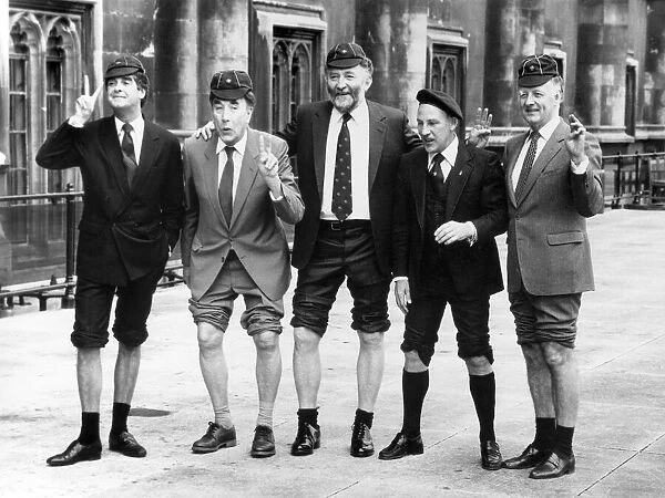 Four former scouts showing off their knees (left to right)- Derek Nimmo, Frankie Howerd