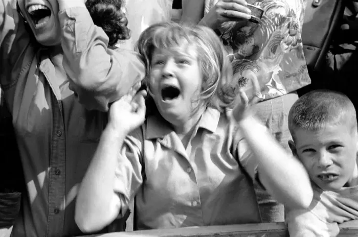Framed Print : Screaming Beatles fans cheer for their idols on the streets of New York City