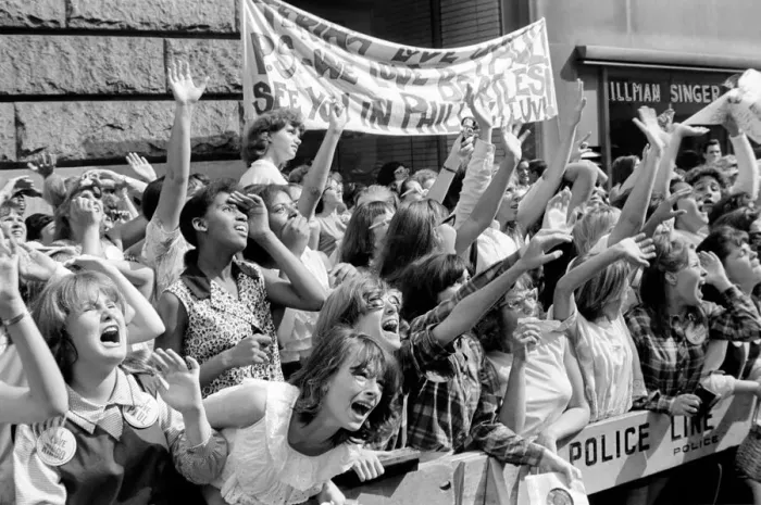 Framed Print : Screaming Beatles fans cheer for their idols on the streets of New York City